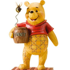 Dulce figura de Winnie The Pooh con su tarrito de miel y una abejita donde se ha mezclado la magia de las figuras de Walt Disney.