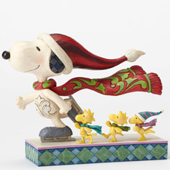 Figura Patinando en Navidad de Snoopy y sus amigos basada en los comics de Penauts de Charles M. Schulz, el artista Jim Shore ha elaborado esta figura con unos 13 cm., de longitud.