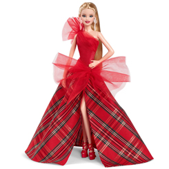 Descubre la elegancia y el encanto de la Muñeca Holiday Barbie Blonde, una joya de la colección "Barbie Signature" de Mattel. Esta muñeca original viene acompañada de una peana