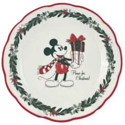 Navidad que se sirve con una sonrisa. Este plato de cena de Mickey Mouse viste la mesa con un aire clásico gracias al borde ondulado con filete rojo y la corona de acebo que enmarca la ilustración central “Home for Christmas!”. 