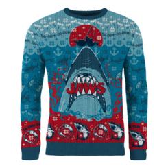 Rojo océano y espíritu navideño en una sola prenda: el suéter navideño Jaws con licencia oficial llega para convertir cada brindis en una escena de culto, con un diseño potente y colores que no pasan desapercibidos.