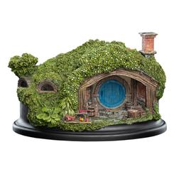 La encantadora estatua de Hobbit Hole - 1 Hill Lane, inspirada en la trilogía de El Hobbit, es una obra maestra de WETA Collectibles. Fabricada en poliresina y pintada a mano